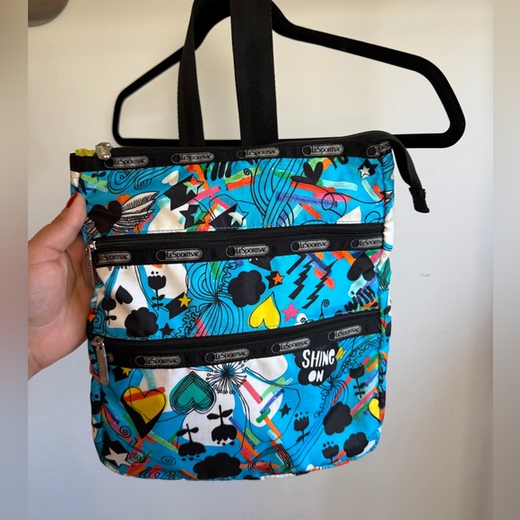Lesportsac Handbags - Lesportsac Turquoise Graphic Messenger Bag with Multicolor Accents